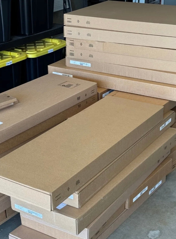 Kitch cabinet door order flat-packed in boxes, stacked in a garage after delivery